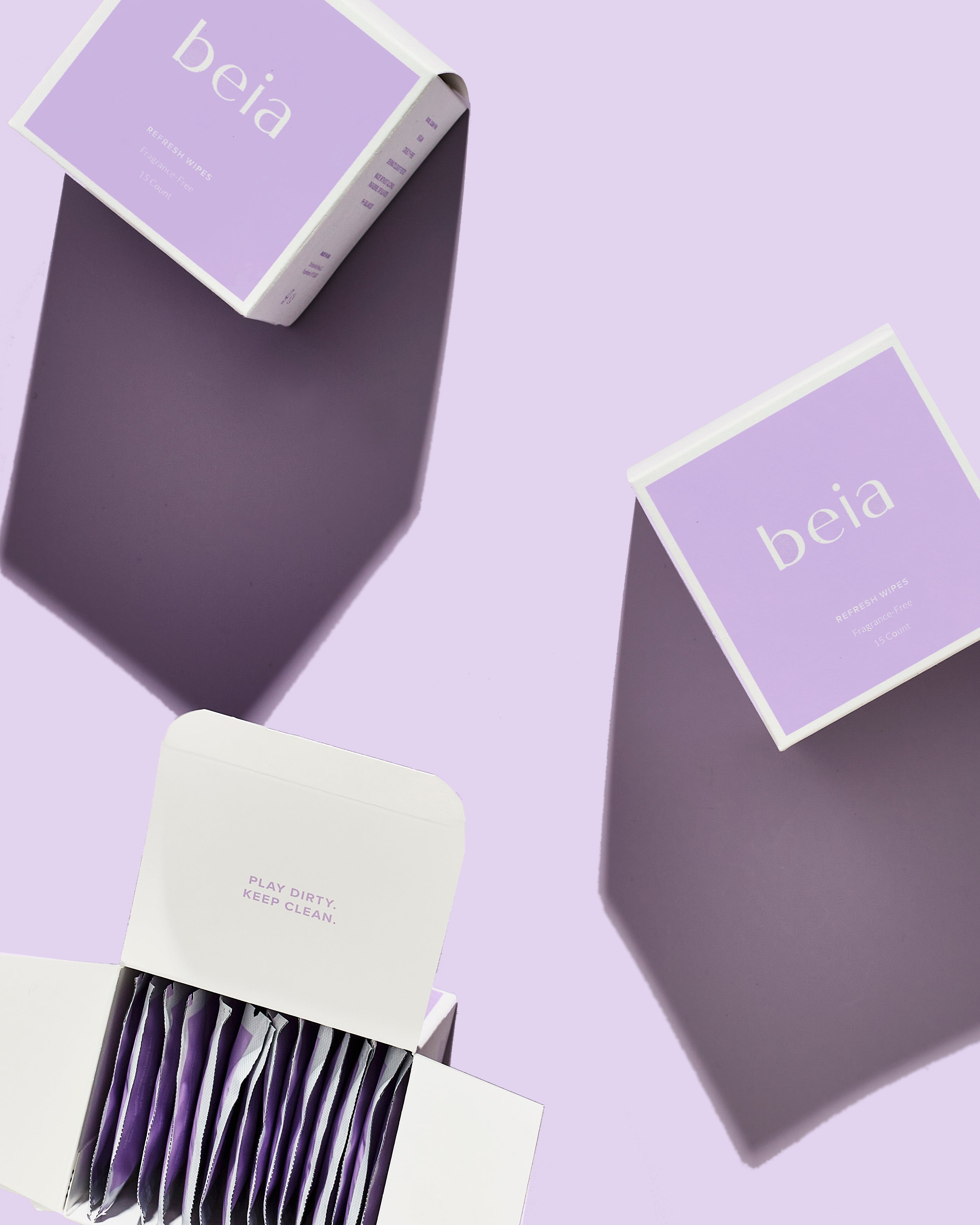 Boxes of refresh wipes on purple background