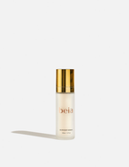 Skincare serum bottle with gold cap on a white background