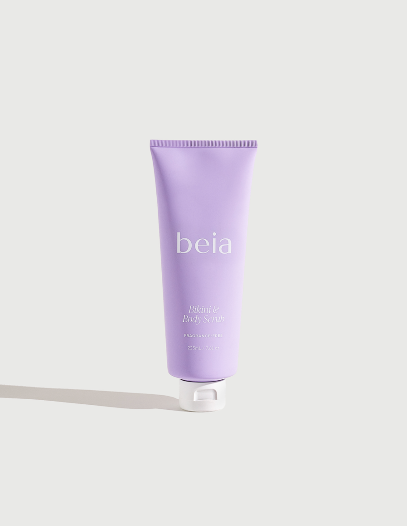 Purple tube of beia body scrub on a light gray background