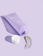 Purple tube of beia body scrub on a purple background