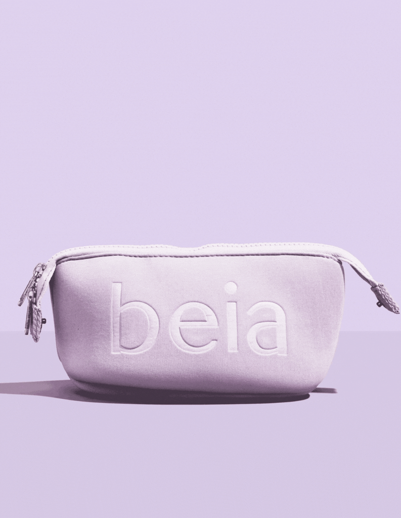 purple background with a purple beia toiletry travel bag 2