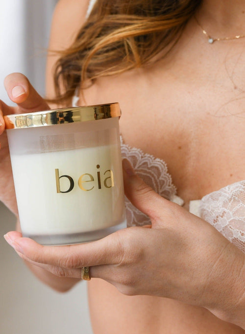 Candle with woman holding the jar